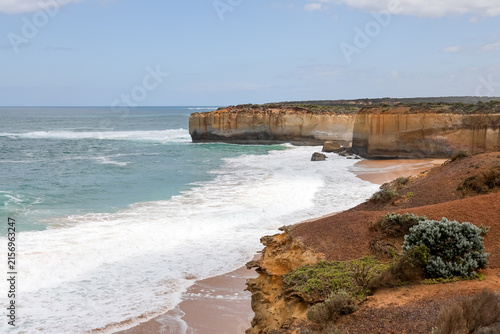 Dramatic Limestone Cliffs and Turquoise Waves at Secluded Beach Cove
