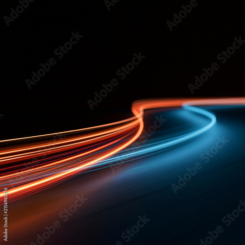 Foto Dynamic luminous lines bend toward the horizon like a futuristic racing track