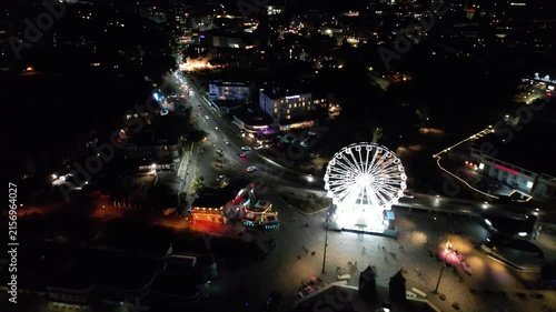 High Angle Night Footage of Illuminated Buildings and Roads with Traffic at Best Tourist Attraction Destination of England at Bournemouth City with Sandy Beach and Ocean of Great Britain, 