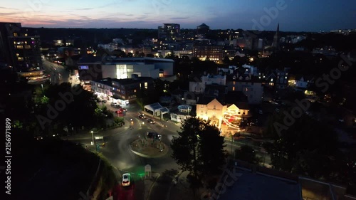 High Angle Night Footage of Illuminated Buildings and Roads with Traffic at Best Tourist Attraction Destination of England at Bournemouth City with Sandy Beach and Ocean of Great Britain, 