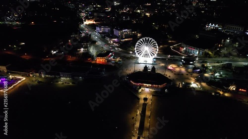 High Angle Night Footage of Illuminated Buildings and Roads with Traffic at Best Tourist Attraction Destination of England at Bournemouth City with Sandy Beach and Ocean of Great Britain, 