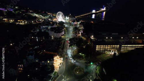 High Angle Night Footage of Illuminated Buildings and Roads with Traffic at Best Tourist Attraction Destination of England at Bournemouth City with Sandy Beach and Ocean of Great Britain, 