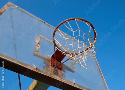 old basketball loop against blue sky