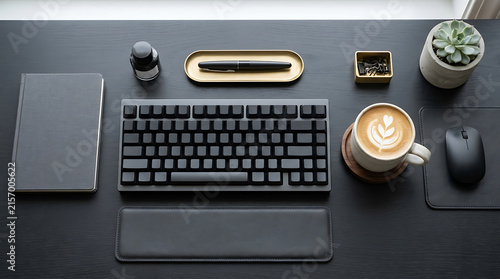 Modern black workspace flat lay with computer keyboard, coffee, and stationery