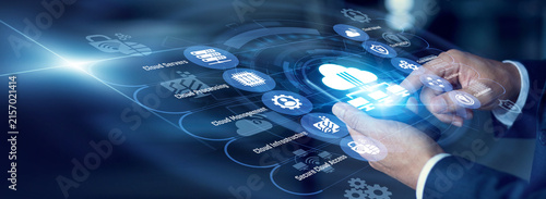 фотографія Systems engineer tracking network usage on a mobile phone for Cloud Computing across a digital world map, analyzing heavy server loads on a bright Virtual screen expanding global storage nodes