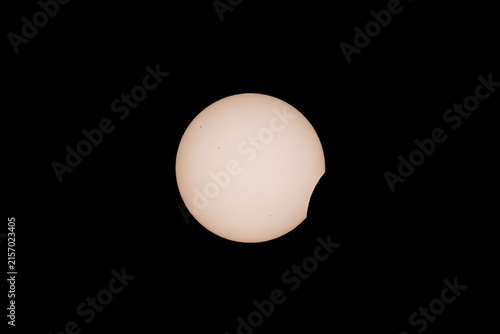 First contact as the moon passes in front of the sun during the solar eclipse in August 2026 over northern span