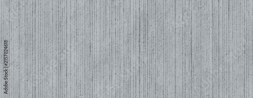 Vertical Grooves on a Gray Concrete Surface