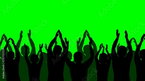 Silhouette video of a crowd of people at a club concert or sporting event, isolated on an Alpha matte background.