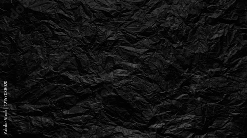 crumpled black paper texture dark wrinkled surface moody abstract background for web design branding and advertising layouts