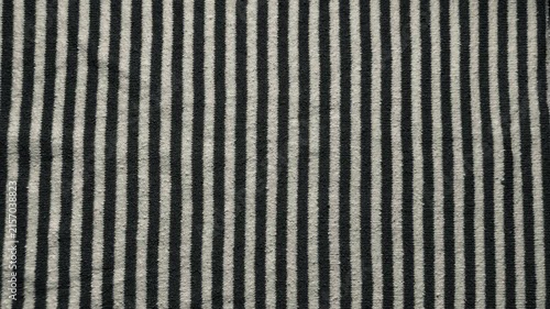 vertical black white striped knit fabric texture evoking cozy calm for minimalist web design background and branding