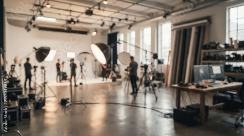 wide angle professional photography studio with high-end lighting gear, cameras, and creative crew in industrial loft.
