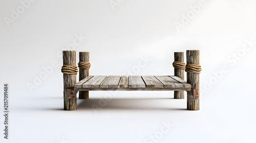 Isolated old wooden pier or small dock on posts wrapped with rope for boats and fishing