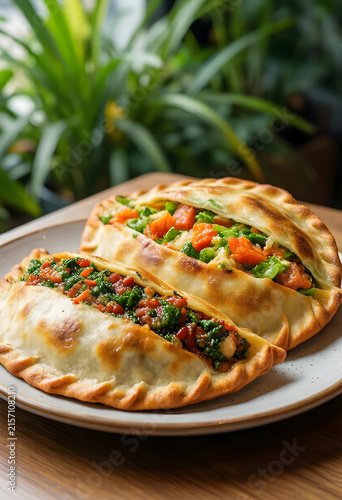 Two savory baked empanadas ...