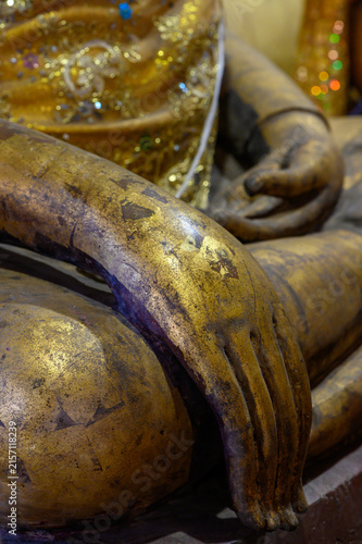 Konstfotografi Close-Up Detail of Buddha Hand Resting on Knee