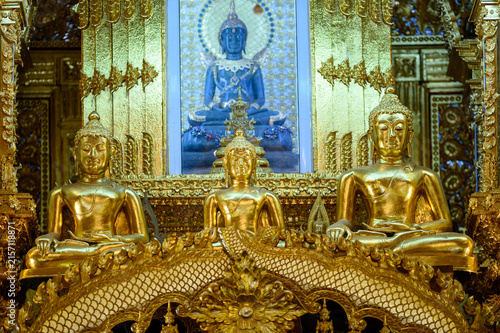 Multiple Golden Buddha Statues at Wat San Pa Yang Luang in Lamphun, Thailand