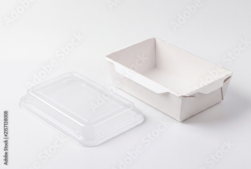 Blank white takeaway food container with clear lid beside it