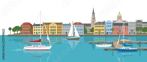 Colorful Waterfront Cityscape with Sailboats and Reflection