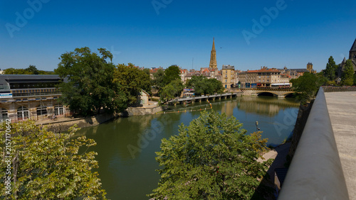 Obraz na plátne Metz city skyline and Temple Neuf spire reflecting on Moselle river water