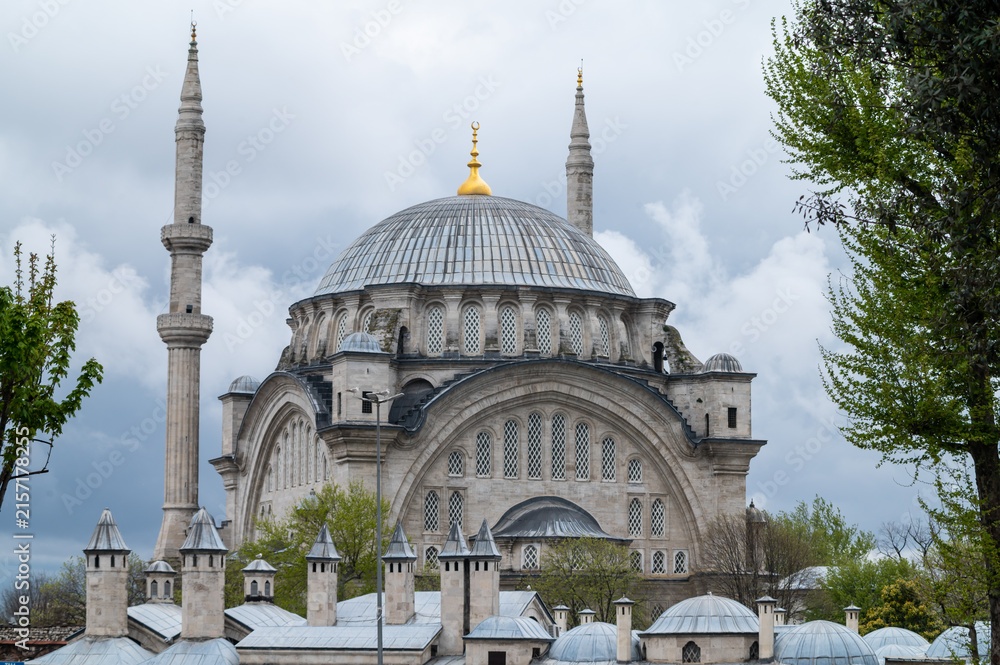 Fototapeta premium Ottoman mosque with a cloudy sky at evening