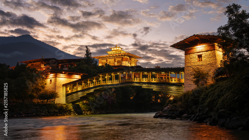 Punakha Dzong and cantilever bridge illuminated at dusk in Bhutan 2025