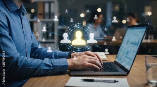 Businessman using laptop with holographic social network concept