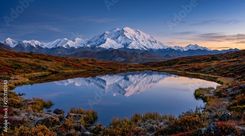Denali National Park Alaska with Denali peak reflected in tundra pond, autumn colors, Professional Editorial Nature Photograph.