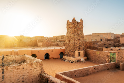 Ancient stone minaret and mudbrick architecture in Chinguetti, Mauritania, 2025