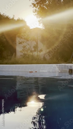 Golden sunset over swimming pool