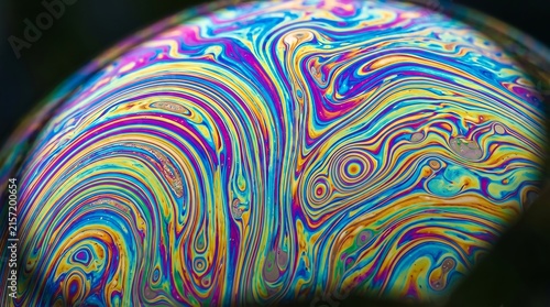 Soap bubble macro - iridescent Newton rings color interference pattern.