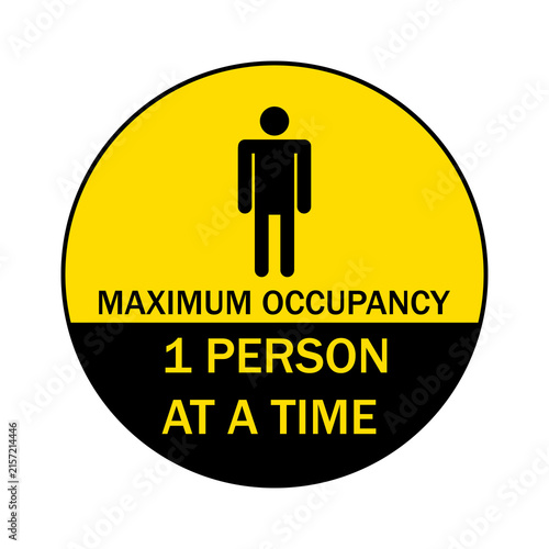 Bild auf Leinwand Round yellow and black maximum occupancy sign for one person at a time