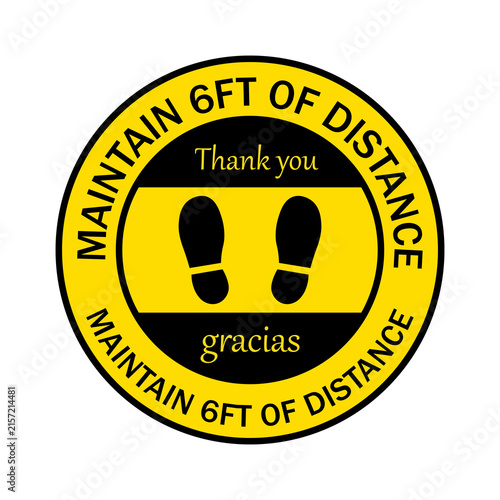 Fotografie Round floor sticker sign to maintain 6 feet of social distance with footprint ic