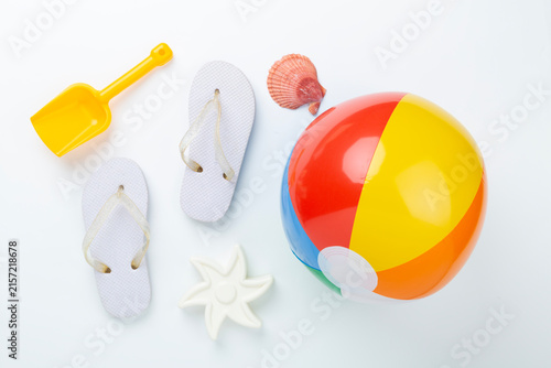 Children's beach accessories on color background, top view