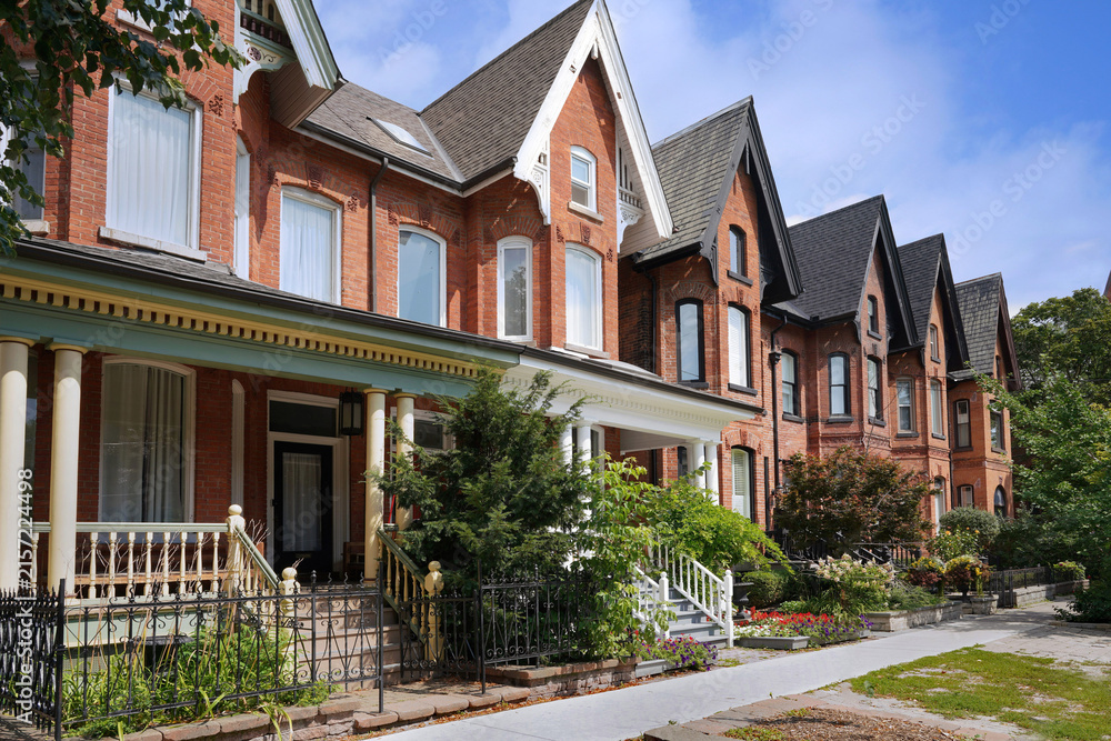 Fototapeta premium Row of original Victorian houses with gables, renovated and gentrified