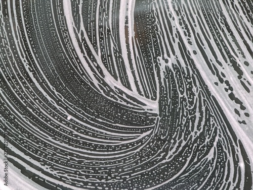 Obraz na płótnie Close-up of swirling water droplets on reflective surface