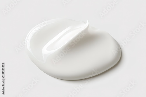 Creamy white cosmetic skincare moisturizer texture isolated on clean neutral background for facial care beauty product.