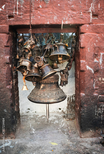 Konstfotografi Hanging bells of various sizes outside a Buddhist temple.