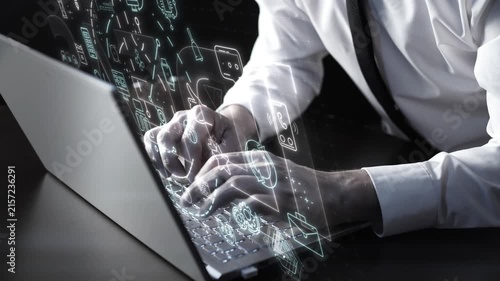 Businessman working on laptop with digital communication icons overlay