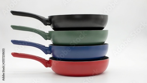 Stacked Colorful Nonstick Frying Pans on White Background