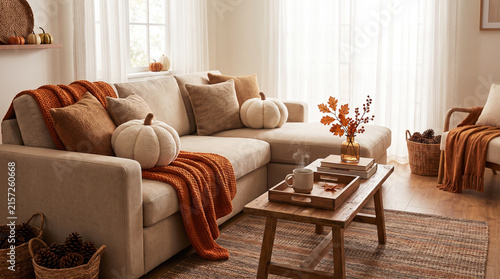 Cozy autumn living room interior with pumpkin decor and warm textures