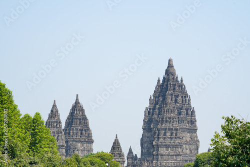 Photography Majestic spires of Prambanan Temple, a 9th-century Hindu site, rise above a canopy of trees in Yogyakarta, Indonesia