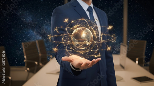 Businessman holding glowing global network hologram for digital transformation and connectivity solutions