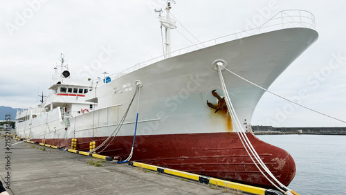 Bild auf Leinwand Large Cargo Ship Moored at Port with Industrial Maritime Logistics Infrastructur
