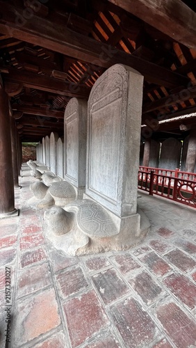 Quadro su tela Stelae of Doctors on stone tortoise bases under wooden pavilion, Temple of Liter