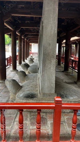 Obraz na płótnie Ancient stone stelae of doctors carved on sacred turtle bases inside the historic Temple of Literature (Van Mieu) in Hanoi, Vietnam