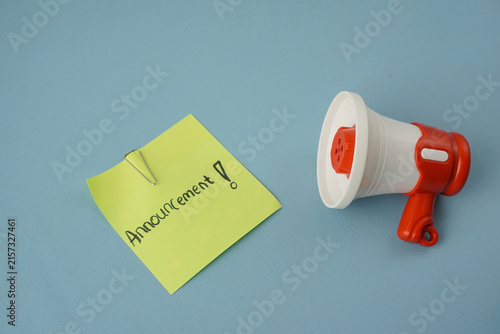 Konstfotografi Red megaphone isolated on a blue background with generous copy space, suitable for announcements, communication, marketing, education, and promotional concepts