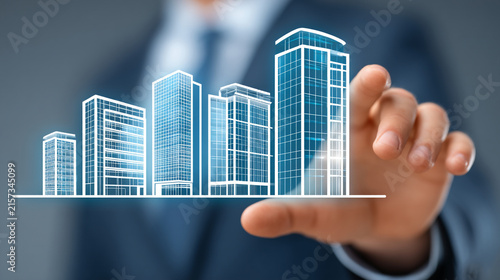 Business executive hand holding a holographic projection of a modern city skyline