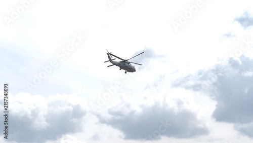 Military Seahawk Helicopter Flying Through Overcast Cloudy Skies in Geelong