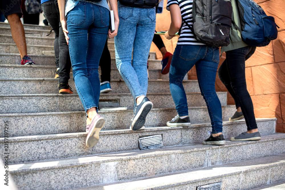 Obraz premium Students ascending outdoor stairs photo