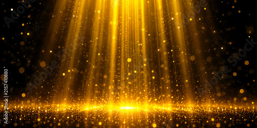 Golden light rays with shimmering particles on dark background particles background abstract