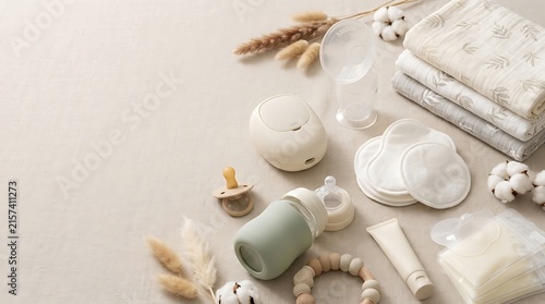 Essential Newborn Baby Care Accessories Set with Bottle Pacifier and Clothing on Neutral Background